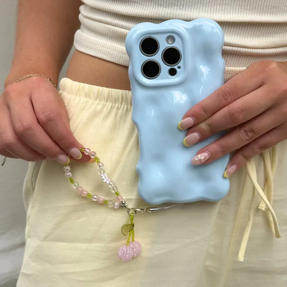 Pink Cherry Phone Charm on a phone